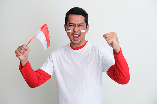 Indonesian man celebrate independence day with excited expression