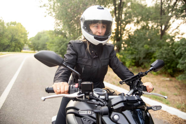 istock Young woman riding a motorcycle 1404876012