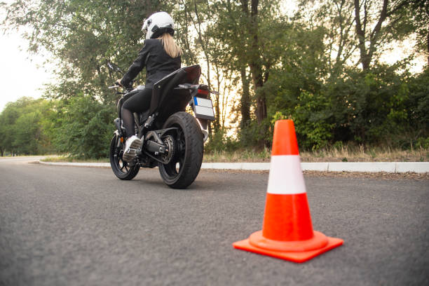 istock Young woman learning to ride a motorcycle 1404876499