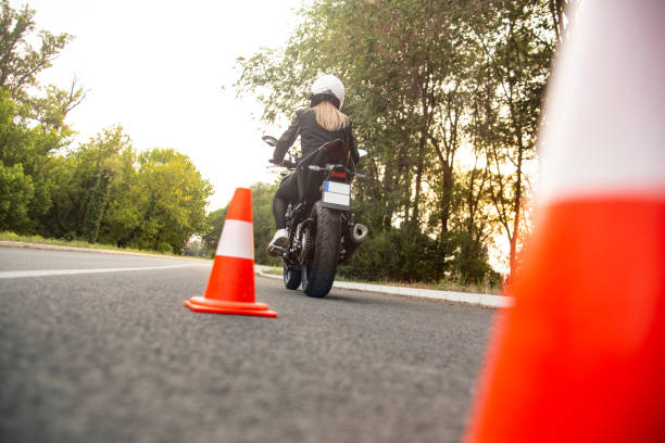 Learning to ride a motorcycle stock photo