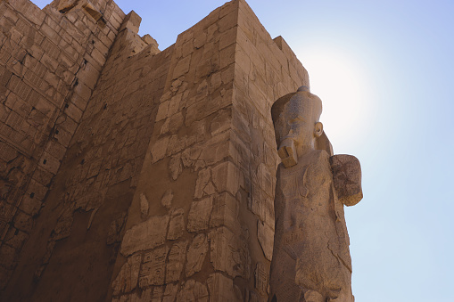Ancient Sandstone Ruins of Old  Egyptian God in the Karnak Temple Complex near Luxor, Egypt