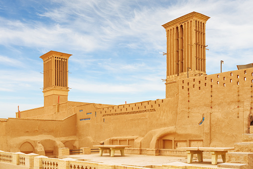 Wonderful view of traditional Iranian windcatcher towers in the historical city of Yazd, Iran. Unique Persian architecture. The ancient town is a popular tourist destination of the Middle East.