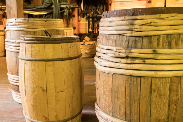 istock Old Wooden Barrels in Warehouse 1404884126