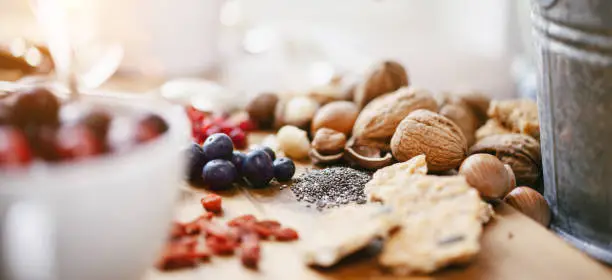 various healthy superfoods on wooden background - selective focus
