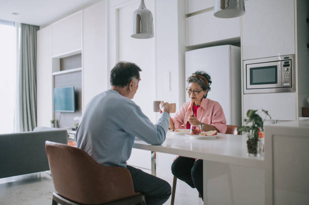 istock Asian chinese senior couple enjoying breakfast during weekend morning 1404886868