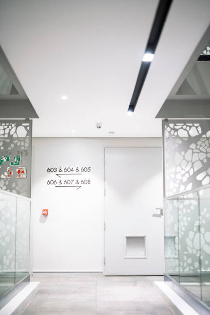 istock Room number with direction arrows glass railing and metal screen decor 1404886911