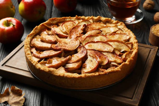 istock Delicious apple pie on black wooden table 1404888074