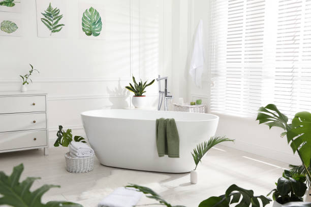 istock Stylish bathroom interior with green plants. Home design 1404889326