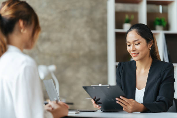 istock Team work process. Two asian women with laptop in open space office. Business concept. 1404890801