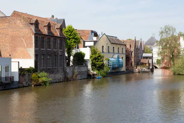 View of Ghent historic center, castle Gravensteen, Leie river  on a sunny day.