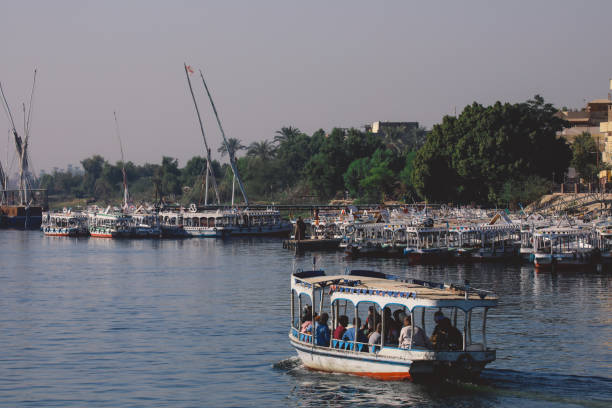 Egyptian Boat on the Nile River for Passengers transportation to Another Riverside in Luxor city stock photo