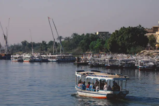 Photo of Egyptian Boat on the Nile River for Passengers transportation to Another Riverside in Luxor city