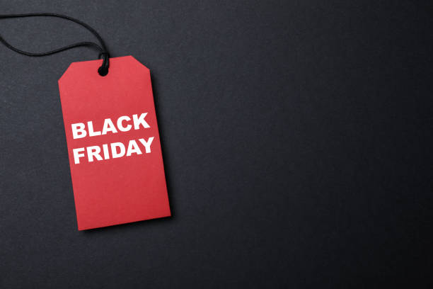 istock Red tag with words Black Friday on dark background, top view. Space for text 1404892885