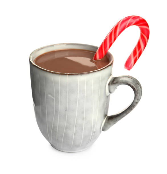 istock Cup of delicious hot chocolate with candy cane isolated on white 1404893655