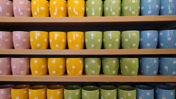 istock Various Colours of Ceramic Mug with Polkadot Pattern at Display Shelf 1404897809