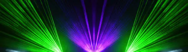 Lasershow festival disco  party background banner panorama - Colorful outdoor laser show with rays streams