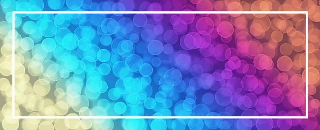 Colorful bokeh in rainbow colors - Abstract background banner panorama, with white rectangle frame