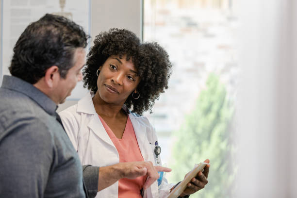 istock Doctor listens attentively to patient's question about test results 1404901964