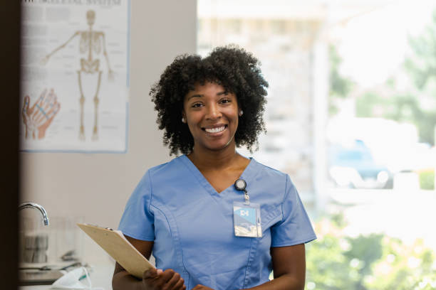 istock Cheerful female intern smiles for camera 1404901990