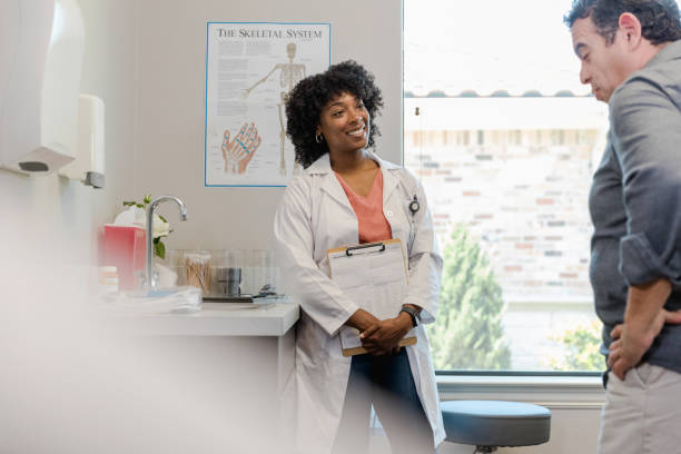 istock Male patient thinks about female doctor's question 1404902074
