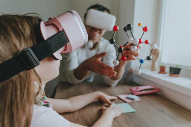 istock Young man describing his daughter configuration of a molecule 1404904689