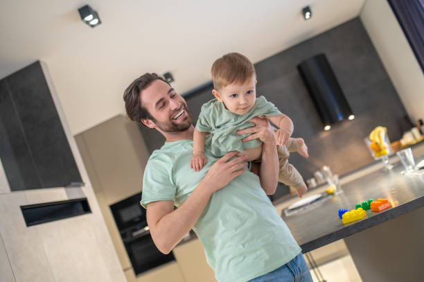 istock Young father spending time with his cute babyboy and looking happy 1404906586