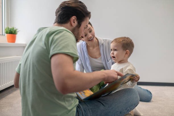 istock Young parents playing with their little son and showing him something 1404906604