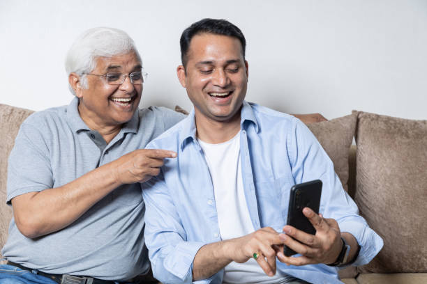 father son having fun together at home, candid moments - generation gap imagens e fotografias de stock