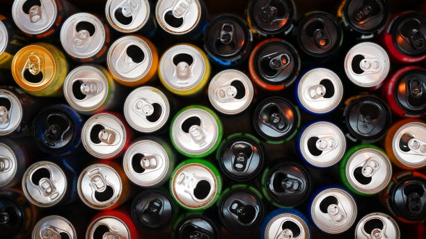 Many opened and drunk cans of different drinks stock photo