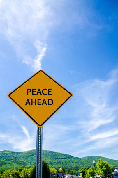 istock Road sign announcing that Peace is ahead 1404908455