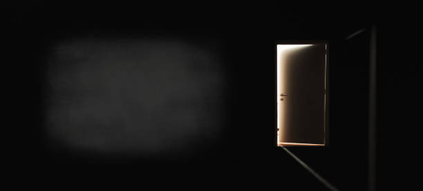 istock Door to the light in a dark 1404910242