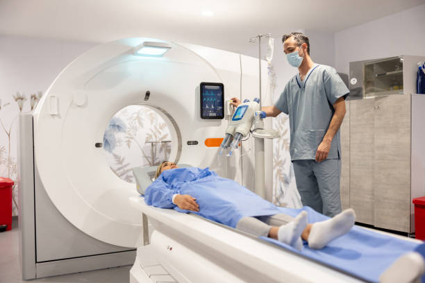 istock Radologist getting a patient ready for an MRI scan 1404912324