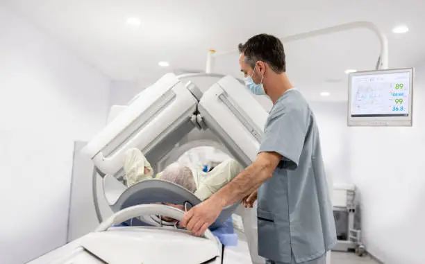 Photo of Senior patient getting a CT scan at the hospital