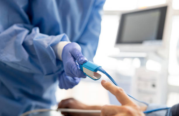 istock Nurse placing a pulse oximeter on a patients finger 1404912463
