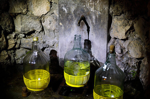 Collecting Fresh Spring Water in Bottles for Drinking Purposes