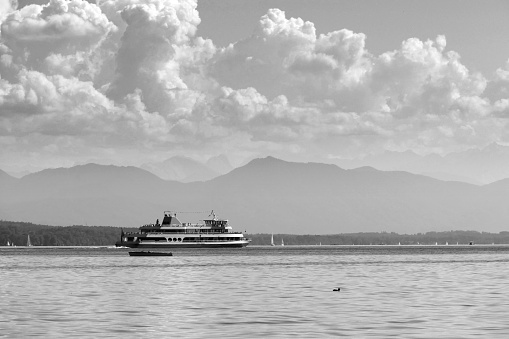 Southwest of Munich about 25 Kilometers, is Lake Starnberg  a popular recreation area in southern Bavaria.\nHere you can see a Ferry of the modern fleet that not only connects the towns around the lake, but also peoples can make an Alpine panorama cruise!