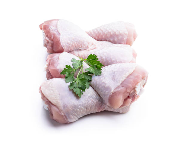 istock Raw chicken legs isolated on white 1404913865