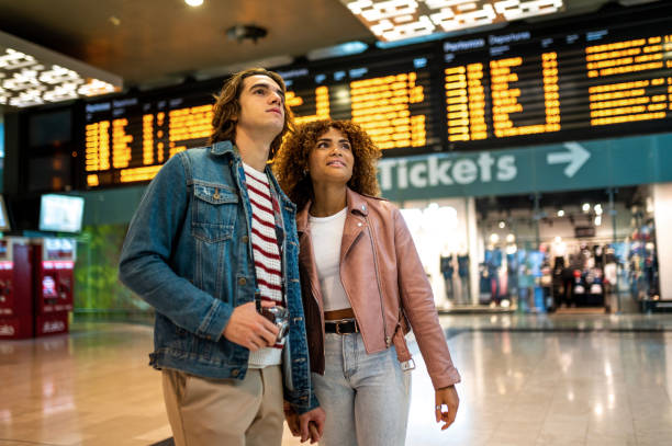 istock Young couple at the train station 1404914071