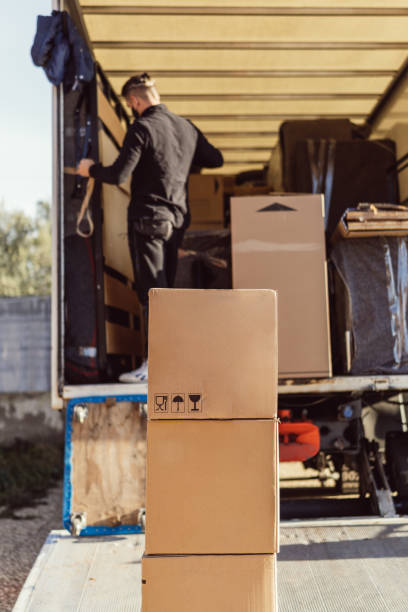 istock 3 stuffed cardboard boxes stacked awaiting placement in a moving truck 1404919910