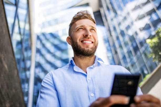 istock Young businessman texting on smartphone 1404920654