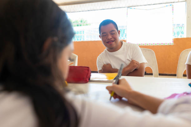 istock Man with sown syndrome in special classes 1404921185