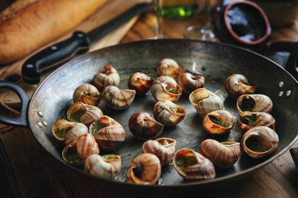 istock Preparing French Escargot Snails with Herb Butter 1404923688