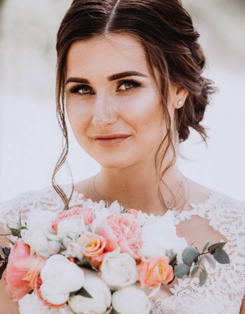 istock Stunning young bride holding bouquet,close up portrait 1404924478