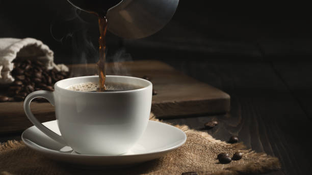 istock Pouring freshly brewed hot cezve coffee into a white cup 1404925539