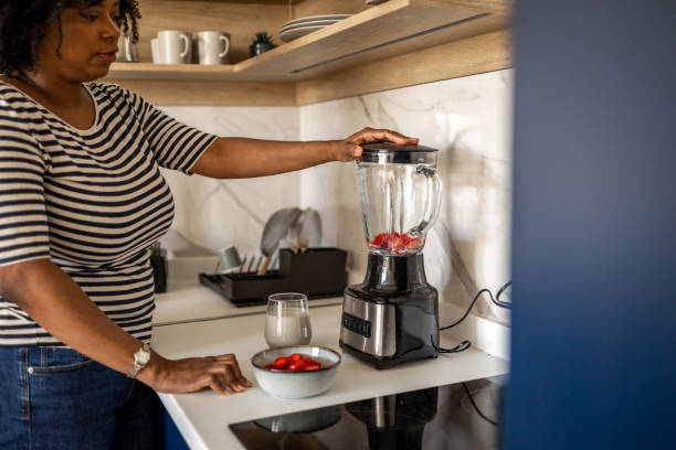 istock Woman preparing smoothie 1404927414