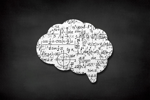 Human brain with mathematical seamless pattern on chalkboard