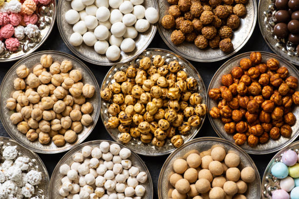 istock Assortment of roasted chickpeas on dark rustic table, turkish traditional nuts, leblebi 1404930733