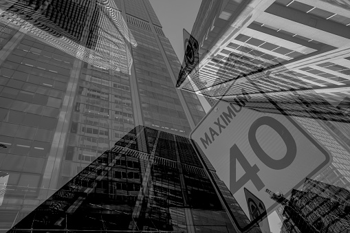 Wall Street sign with a background of skyscrapers in Lower Manhattan, New York City