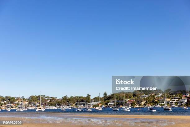 Coastal Town With Bay Of Water Blue Sky Background With Copy Space Stock Photo - Download Image Now