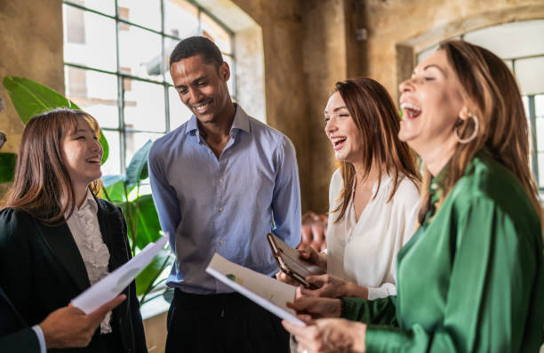 istock Group of business people discussing cheerfully with smile while having fun together 1404933496